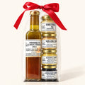 Emballage cadeau à l'érable : vinaigrette au sirop d'érable et quatre petits pots Godbout, boucle rouge, fond crème
