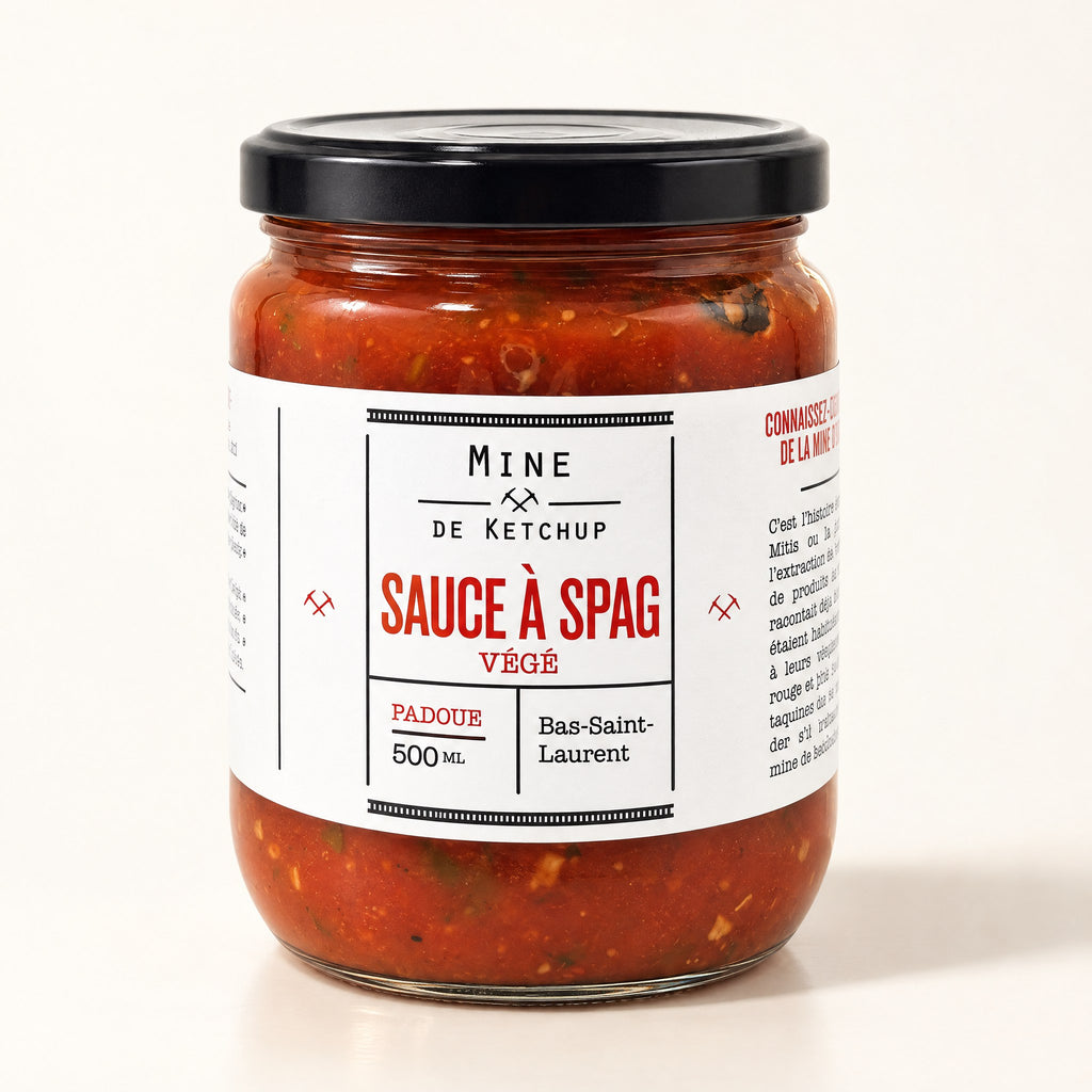 Pot de sauce à spag véggie en verre avec couvercle noir, posé seul sur fond crème