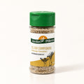 Pot de Sel du Pèlerin aux champignons, épices en grains visibles, posé seul sur fond crème