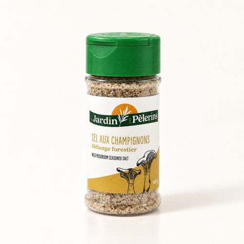 Pot de Sel du Pèlerin aux champignons, épices en grains visibles, posé seul sur fond crème