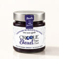 Pot de tartinade Croque bleuet aux bleuets sauvages, pot en verre avec couvercle argenté sur fond crème